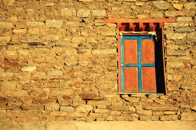 Closed window on wall of building