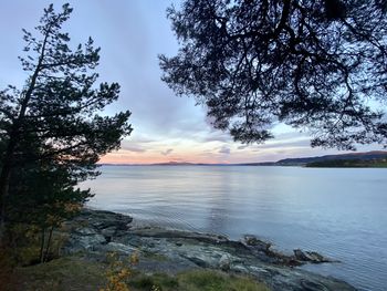 Scenic view of lake against sky during sunset