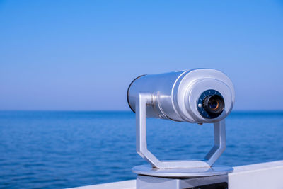 Tourist binoculars. binocular telescope on the observation deck for tourism. sea background. sopot