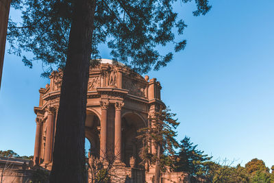 Low angle view of historical building against blue sky