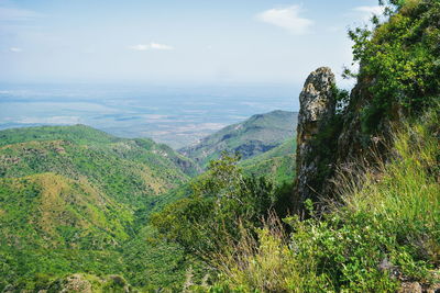 Volcanic rock formations against a mountain background,  oloroka mountain range, rift valley, kenya