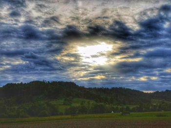Scenic view of field against sky during sunset