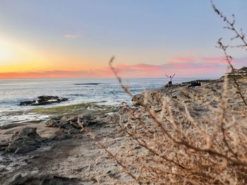 Scenic view of sea against sky during sunset