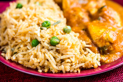 Close-up of food in plate on red napkin