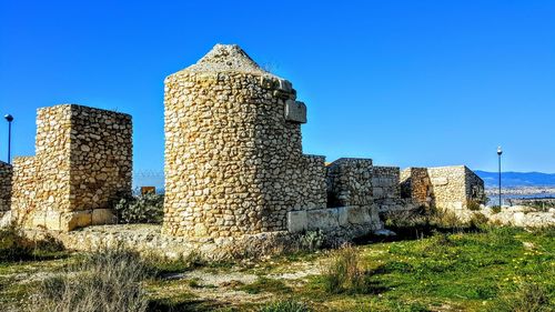 Historic building at cagliari against blue sky