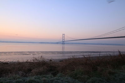 Scenic view of sea against clear sky during sunset