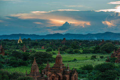 View of temples against cloudy sky