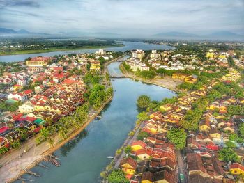 High angle view of river amidst buildings in city