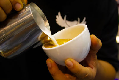 Close-up of hand holding ice cream