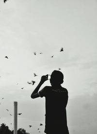 Close-up of woman against sky