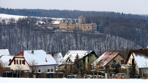 Buildings in city during winter