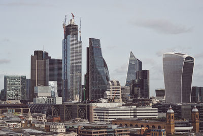 Modern buildings in city against sky