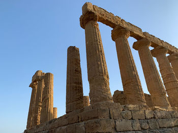 Low angle view of old ruin against sky