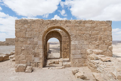 View of old ruin building against cloudy sky