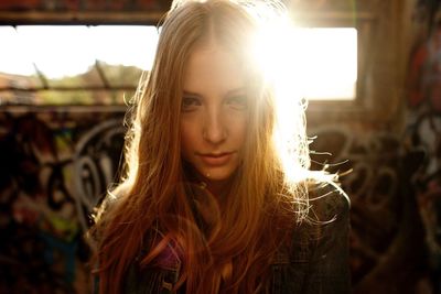 Close-up portrait of a content young woman