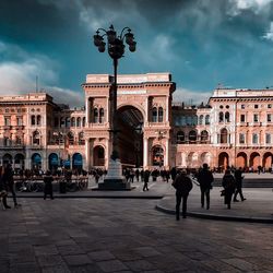 People in front of historical building