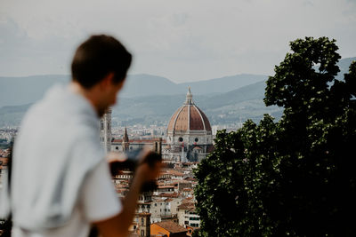 Panoramic view of city and buildings against sky