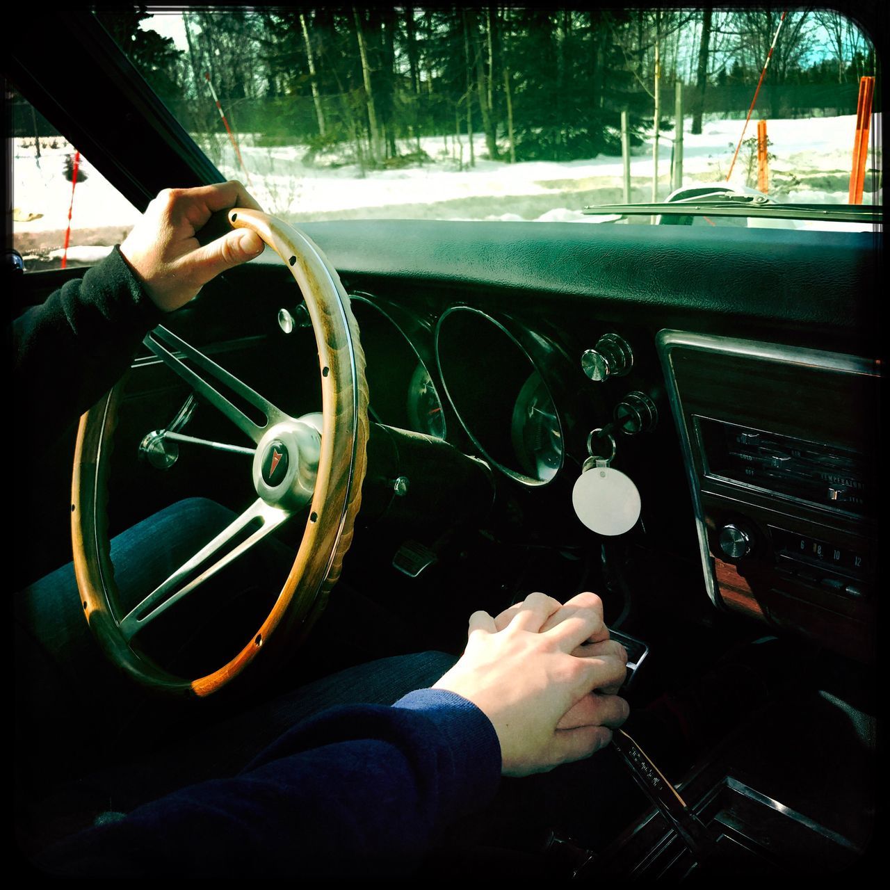 human hand, steering wheel, vehicle interior, transportation, one person, dashboard, human body part, driving, mode of transport, control, windshield, car interior, real people, car, holding, men, speedometer, control panel, indoors, day, close-up, cockpit, piloting, one man only, gauge, people