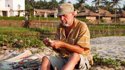 Man working with woman sitting in farm