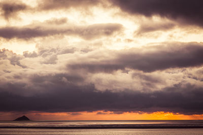 Scenic view of dramatic sky over sea