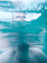 Scenic view of sea against blue sky