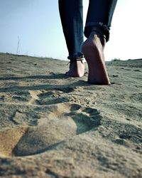 Low section of woman standing on land