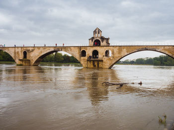 High water in rhône river with pont d'avignon