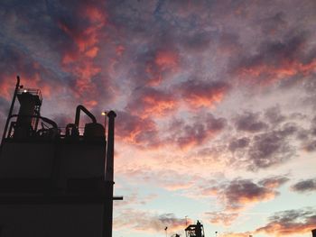 Low angle view of cloudy sky at sunset