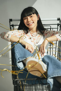 Portrait of a smiling young woman playing piano