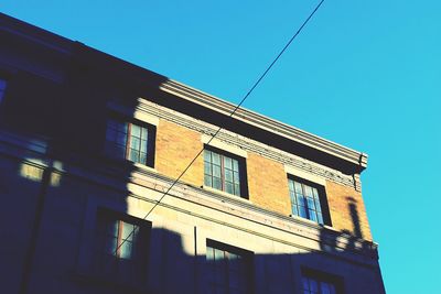 Low angle view of building against blue sky