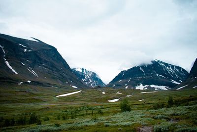 Scenic view of snowcapped mountains against sky