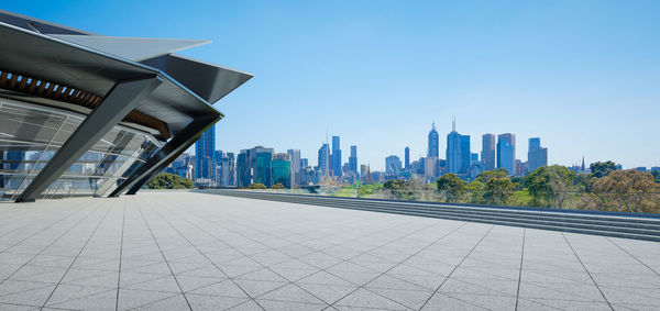 View of buildings in city against clear sky