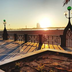 Sun shining through clouds over sea