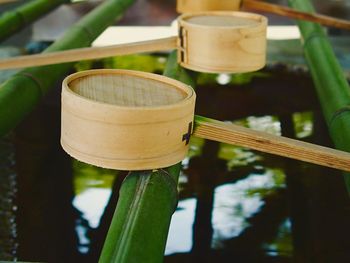 Close-up of ladles on bamboo