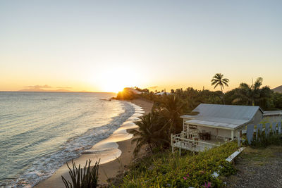 Scenic view of beach against sky during sunset