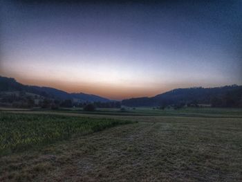 Scenic view of field against clear sky