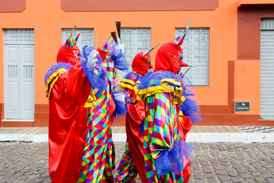 Group of people wearing venice carnival costumes during the carnival 