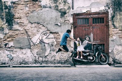 View of a woman standing on wall