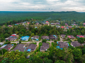 High angle view of houses and buildings against sky