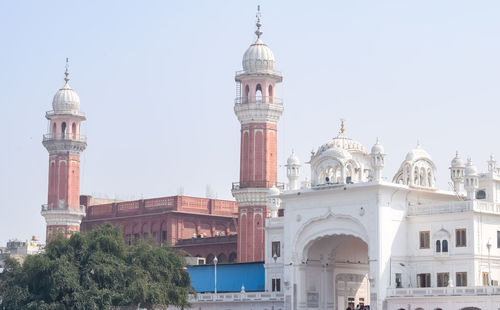 Low angle view of mosque against clear sky