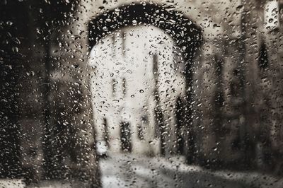 Full frame shot of wet glass window in rainy season