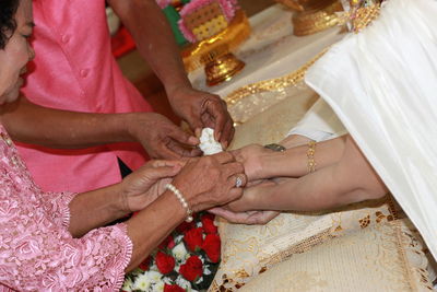 Close-up of couple holding hands