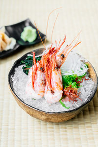 Close-up of seafood served in bowl on table