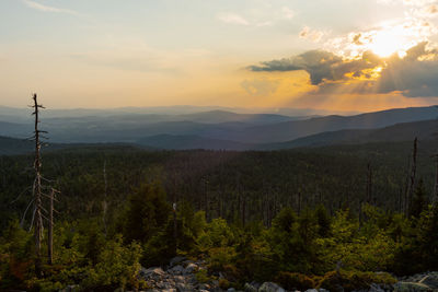 Scenic view of landscape against sky during sunset