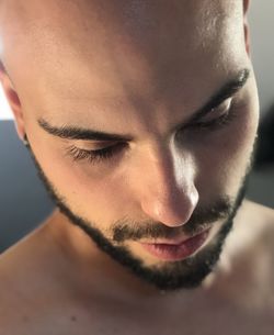 Close-up of shirtless young man