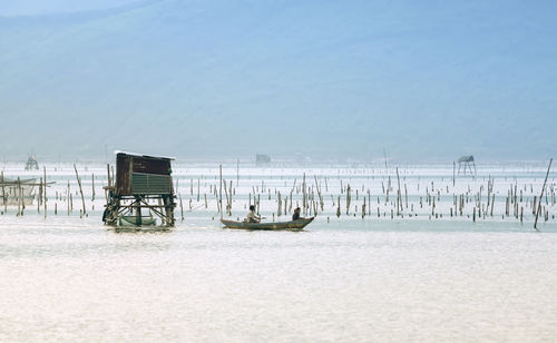 Scenic view of sea against sky during winter