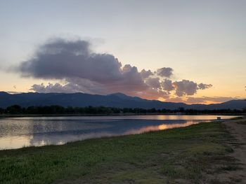 Scenic view of lake against sky during sunset