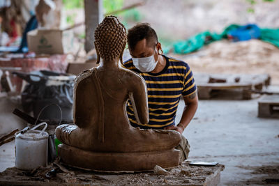 Man working in mud