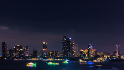 Illuminated buildings in city at night