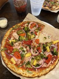 High angle view of pizza served on table